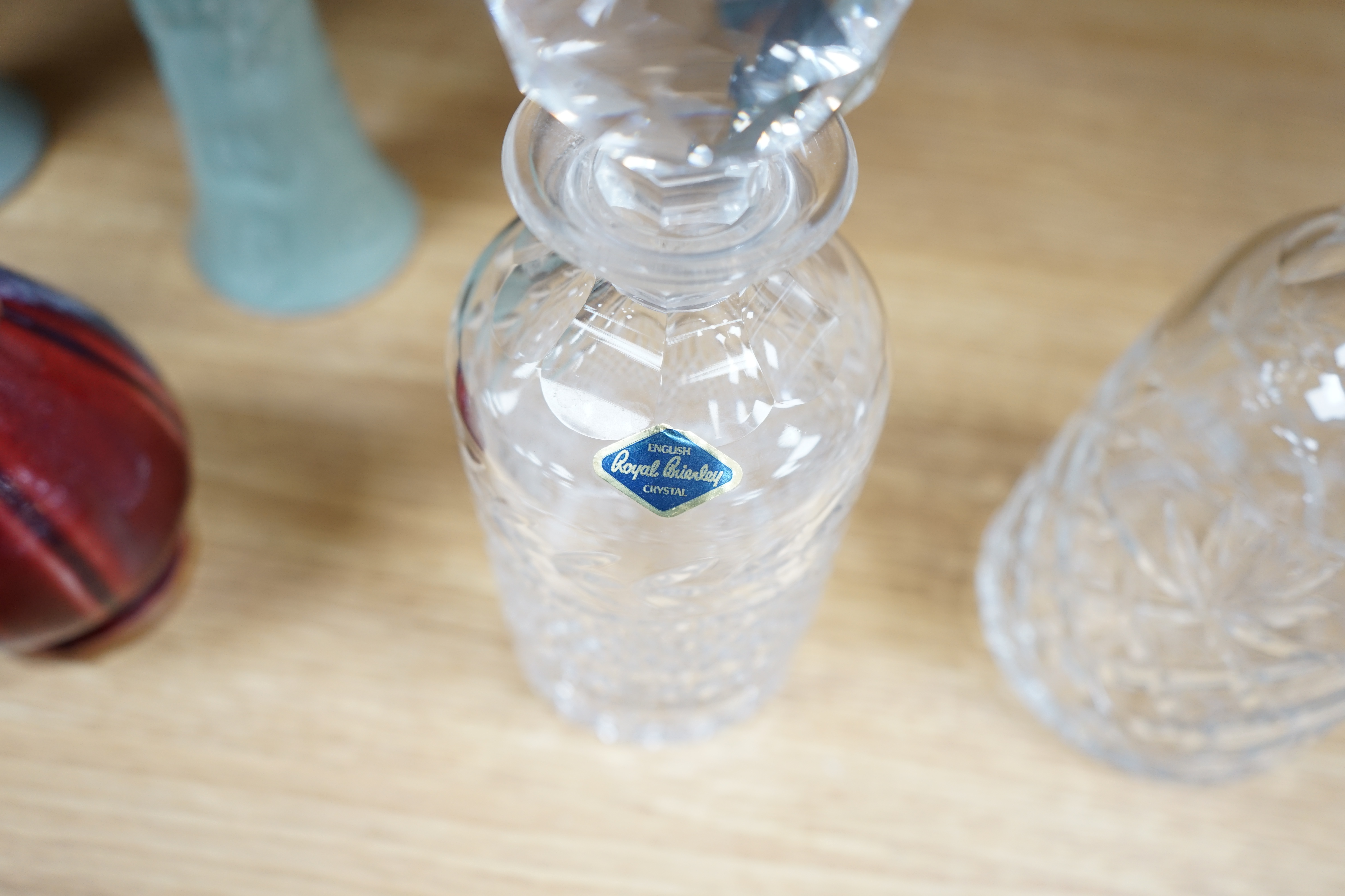 A cut glass ship’s decanter, two others and three various cut glass candle sticks, tallest decanter 30cm high. Condition - good